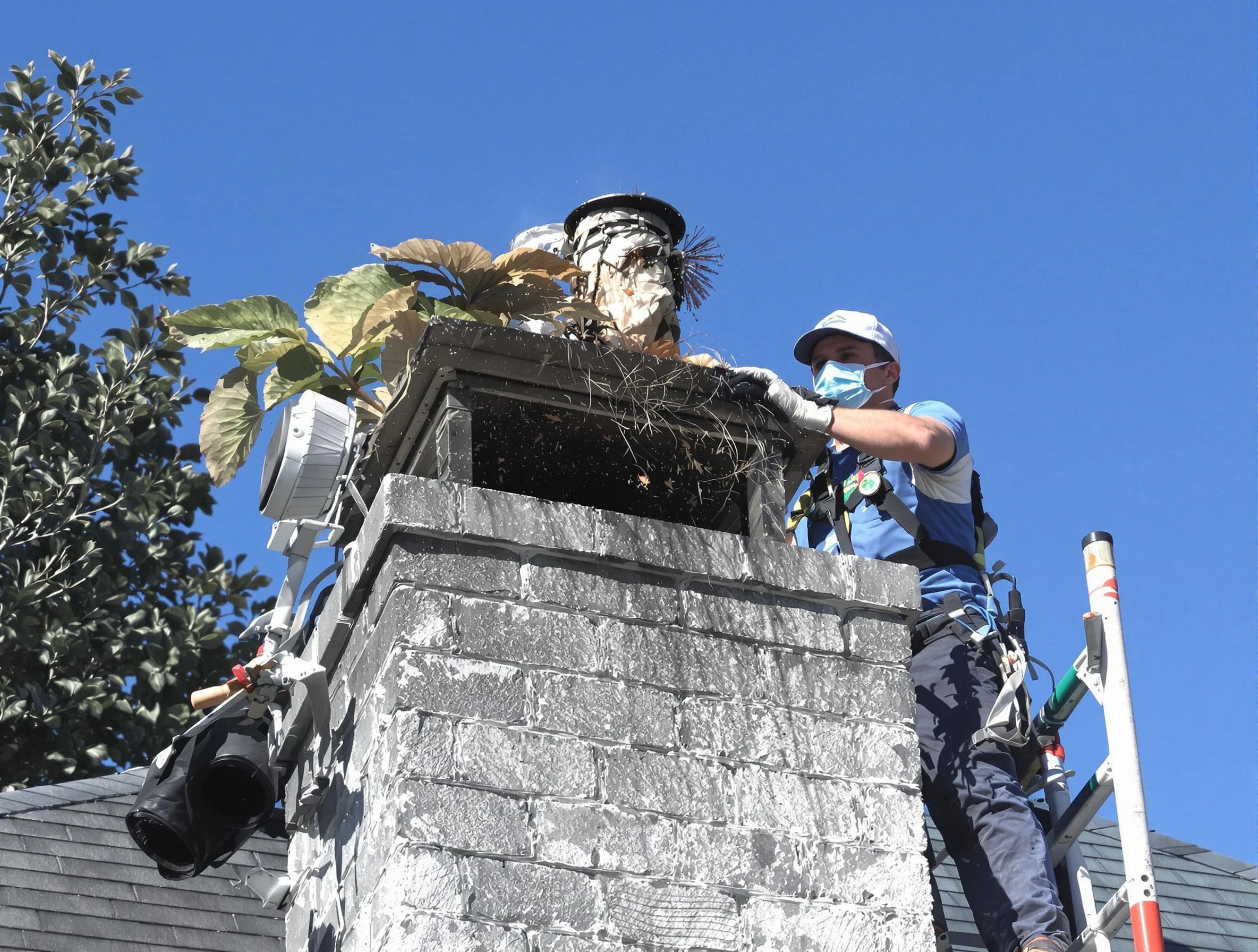 Berkeley Chimney Sweep specialist performing chimney cleaning in Berkeley, NJ